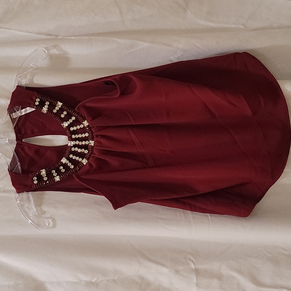 NWOT- Burgandy Bling color women's top. Never worn!